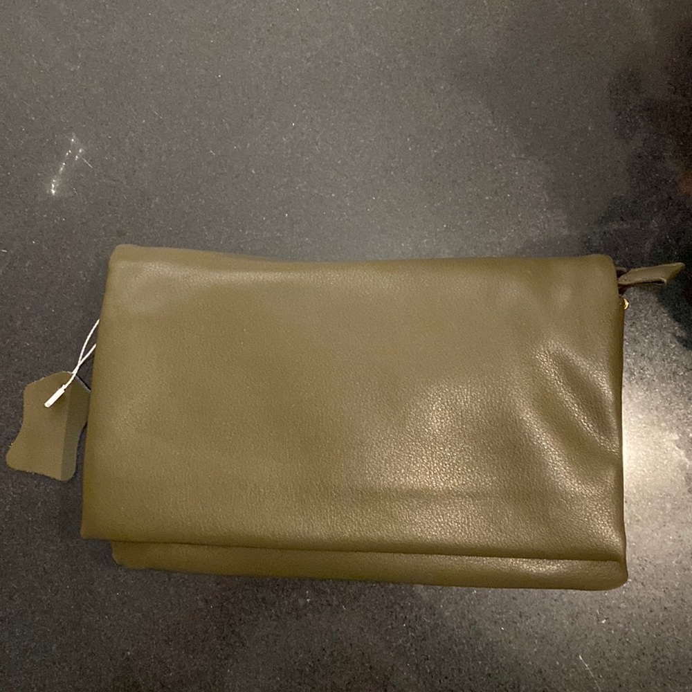Beautiful new purse/crossbody. Brand new never used. Gold colored hardware.